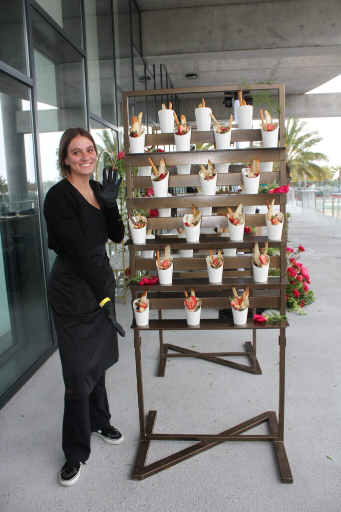 Corporate catering San Diego - girl with stacked apps - Urban Solace.